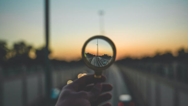 Looking at a long road through a magnifying glass