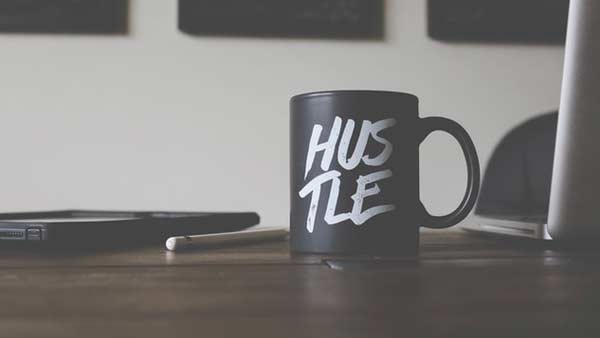 Cup with the text "Hustle".