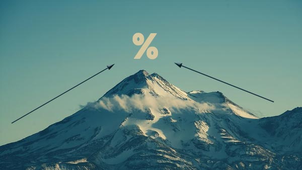 Arrows reaching the peak of a mountain