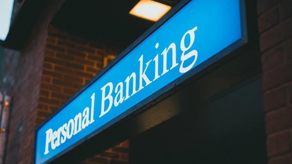 Bright blue sign with text that reads Personal Banking