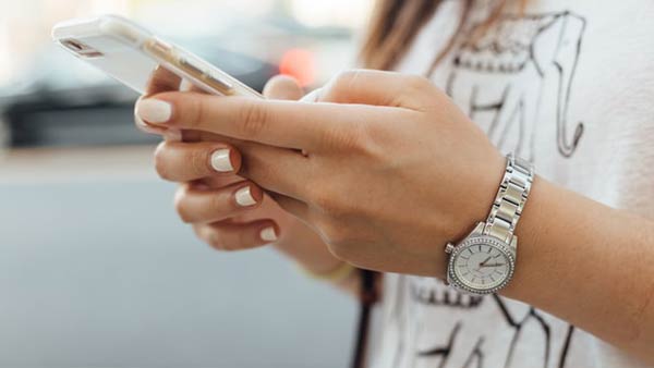 Woman holding mobile phone