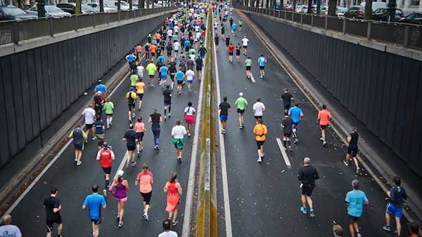 Crowd of people running